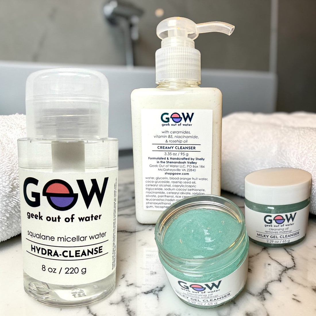 GOOW The Double Cleanse oil and gel cleanser set on a bathroom counter