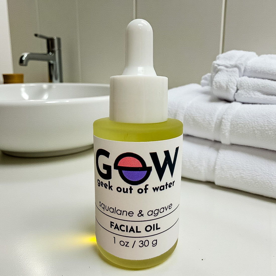 GOOW Squalane and Agave Facial Oil bottle on a bathroom counter