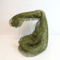 Green net sponge draped over a stand 