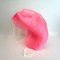 Pink net sponge draped over a stand 